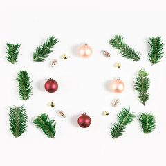 Festive composition of Christmas decorations on white background.