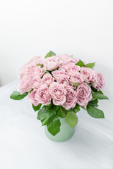 Roses lilac and pastel colors. Bright bouquet in metal bucket. concept of flower shop. vertical photo