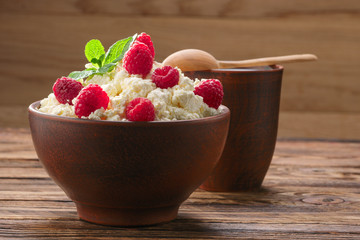 Dairy products: milk, cottage cheese, raspberry and mint. Copy space background
