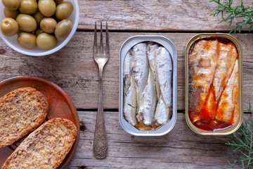 Cans of sardines, olives and lemon