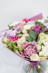 Beautiful spring bouquet . Arrangement with various flowers. The concept of a flower shop. A set of photos for a site or catalogue. Work florist.
