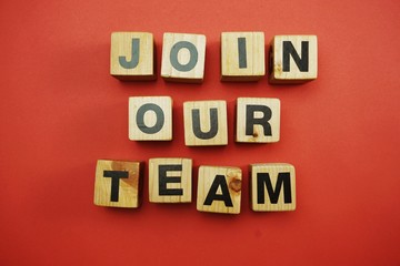 join our team text alphabet letters on wooden background