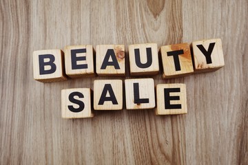 beauty sale word made from wooden cubes with letters alphabet