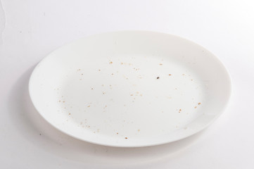 White dirty plate with crumbs