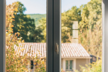 Handle and fittings on an old wooden window in a rural house