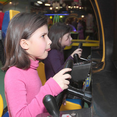 Fototapeta na wymiar Girls playing simulators