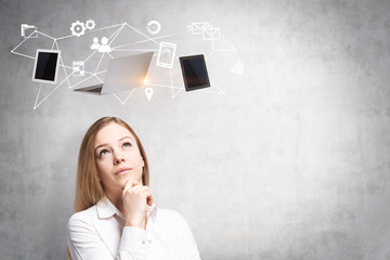 Blonde woman thinking about computer network