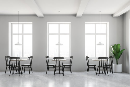 White cafe interior, black chairs