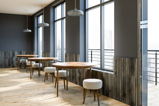 Gray cafe interior, round tables