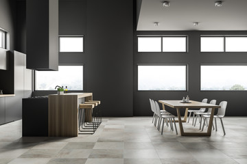 Interior of gray kitchen and dining room