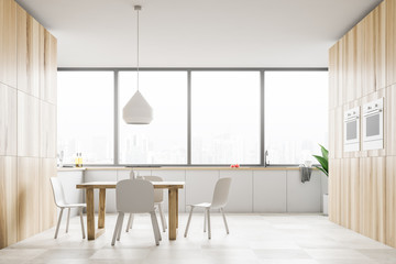 Panoramic white kitchen with wooden table