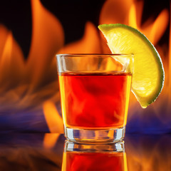 tequila shot glass and fire