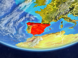 Spain on realistic model of planet Earth with country borders and very detailed planet surface and clouds.