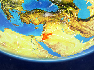 Jordan on realistic model of planet Earth with country borders and very detailed planet surface and clouds.