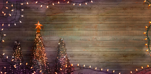Christmas trees on wood. Fairy Lights
