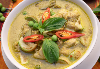 Thai food chicken green curry on table background ,Green Curry With Chicken