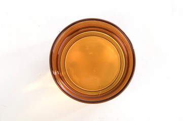 Orange glass with water top view