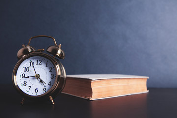 alarm clock with a book