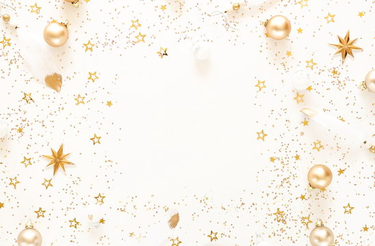 Christmas composition background pattern from gold and white Christmas decorations . Xmas of New Year's Christmas balls. Winter holiday concept.Flat lay. Top view. Copy space