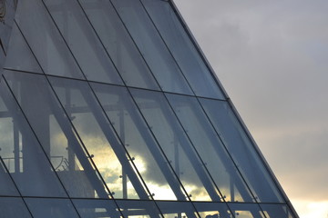 Fototapeta na wymiar View through glass roof. City multicolor sunset . 