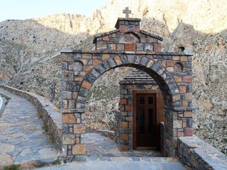 Arch at the stairs to the gorge of Kourtaliotiko, Crete.