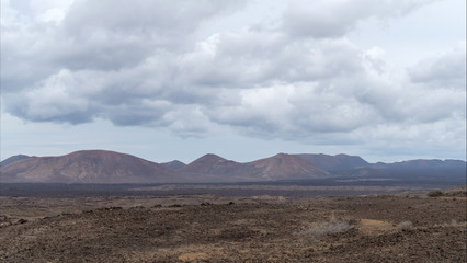 Fototapeta na wymiar Arid volcanic area, Lanzarote Island, Canary, Spain