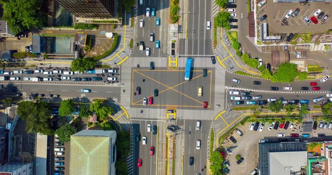 JAKARTA, Indonesia - October 31, 2018: Aerial hyperlapse of traffic on the road junction in Jakarta city, Indonesia. Shot in 4k resolution
