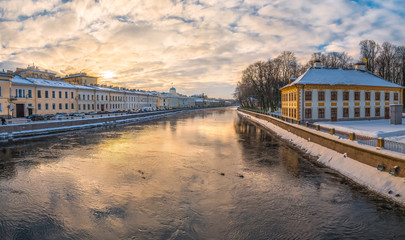 Fototapeta premium Winter St. Petersburg. The first frost. River Fontanka. Summer Palace of Peter I. Embankment of the Fontanka River. Ducks feed.