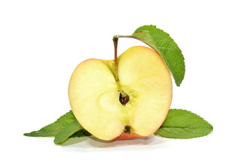 Half apple with green leaves on white background