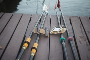 sport oars laying on the float near the river