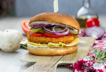 Chikenburger Chicken breast cutlet, Iceberg lettuce, cheddar cheese, tomatoes, pickled cucumbers, red onion, chicken egg, Tar-Tar sauce