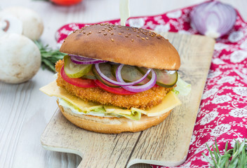Chikenburger Chicken breast cutlet, Iceberg lettuce, cheddar cheese, tomatoes, pickled cucumbers, red onion, chicken egg, Tar-Tar sauce