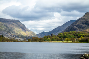 Reflections at Llyn Padarn with Dolbadarn Castle at Llanberis in Snowdonia National Park in background - Wales