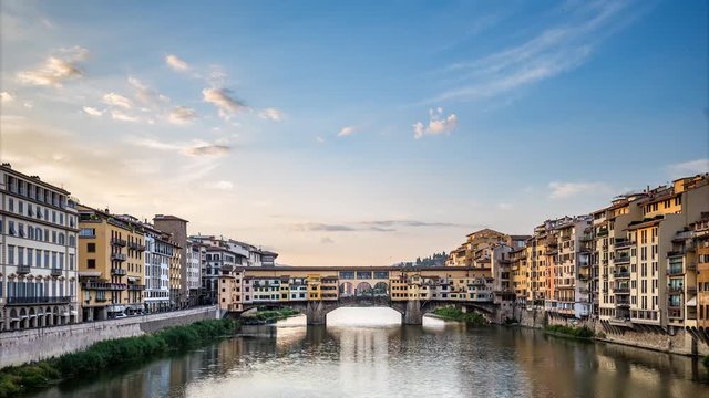 Scenic view on Ponte Vecchio in Florence, Italy, on a summer day with dramatic clouds. Travel background. 4k timelapse. 