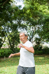 Asia senior man exercise in the park, Exercise with handgrip in the park