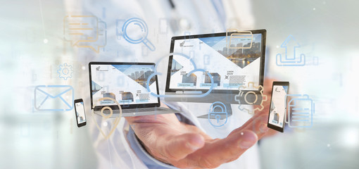 Doctor holding a Devices connected to a cloud multimedia network 3d rendering - obrazy, fototapety, plakaty