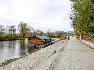 Fototapeta na wymiar Restaurant on water. Restaurant on the river Ibar in Kraljevo. Autumn, cloudy day.