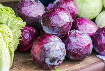 Fototapeta na wymiar Red fresh cabbage of new harvest ready to sale