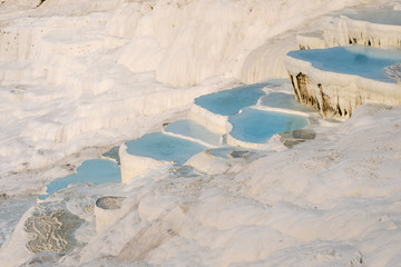 Travertine pools and terraces with blue water, Pamukkale, Turkey