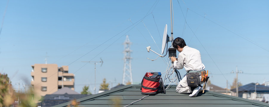 Antenna installation works at a rooftop.