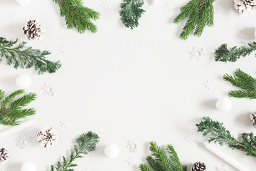 Christmas composition. Christmas decorations, fir tree branches,. pine cones on pastel gray background. Flat lay, top view, copy space