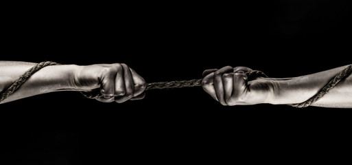Rope, cord. Hand holding a rope, climbing rope, strength and determination concept. Safety. Macro...