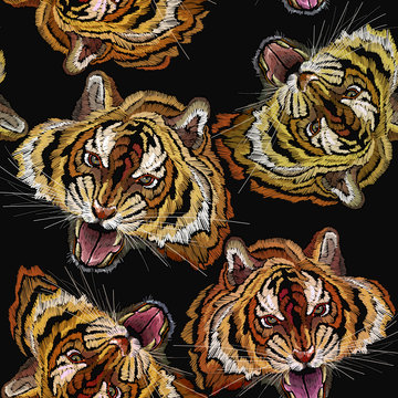 Embroidery tiger head seamless pattern. Clothes, textile design template
