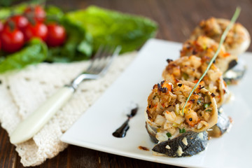 White fish rolls stuffed with crab meat and onions