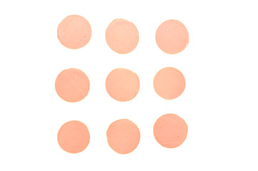 Nine round pieces of boiled unstructured sausages are laid out on an image isolated on a white background.
