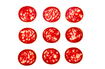 Nine round pieces of smoked sausage isolated on white background.