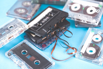 music cassettes on the blue table background