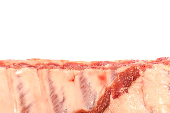 Pork ribs on the edge of the image isolated on white background.