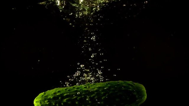 	Falling of cucumber in water. Slow motion.