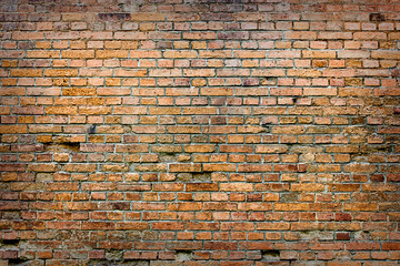 .texture of an old brick wall close-up of an orange brick